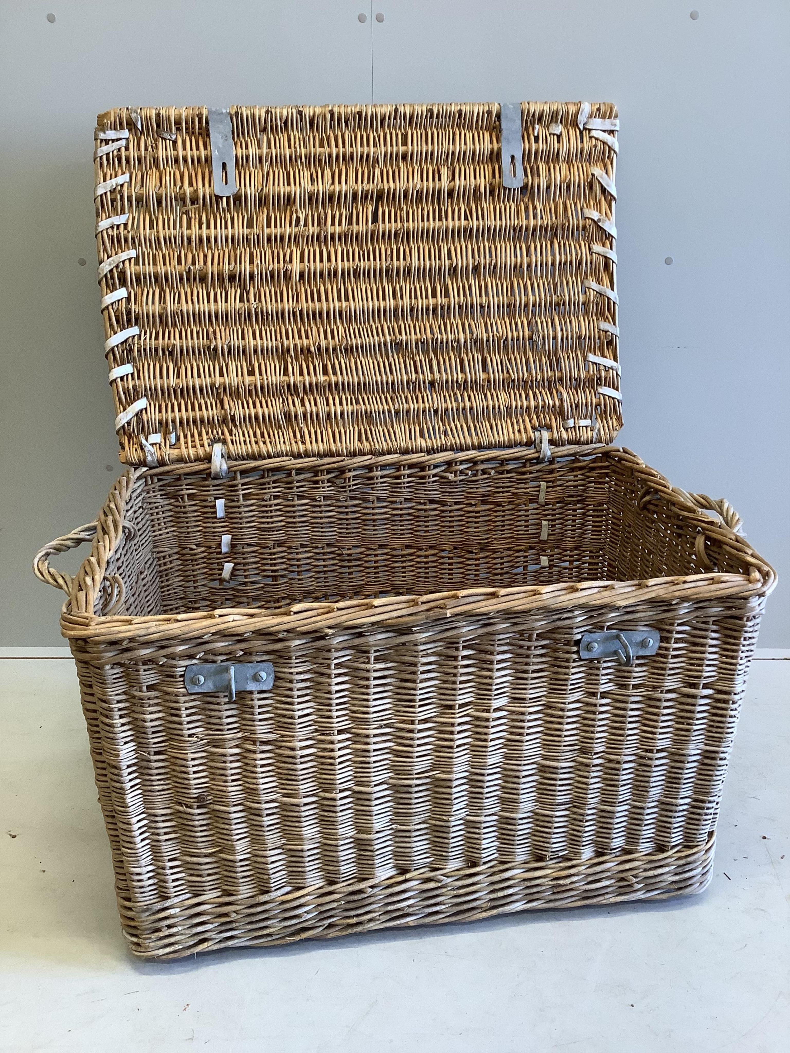 A vintage wicker laundry basket, width 96cm, depth 63cm, height 61cm